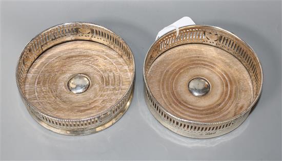 A pair of George V pierced silver wine coasters by Harry Freeman, London, 1911,